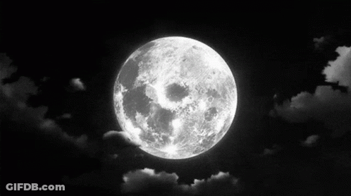 A Black And White Photo Of A Full Moon In The Night Sky GIF