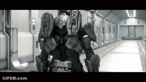 A Black And White Photo Of A Futuristic Soldier With The Letter A On The Back Of His Helmet GIF