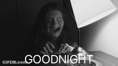 A Black And White Photo Of A Ghost Sitting Next To A Lamp With The Words Goodnight Below It GIF