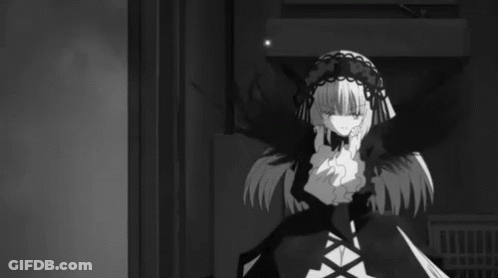 A Black And White Photo Of A Girl In A Gothic Outfit GIF