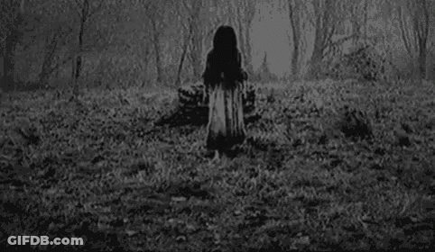 A Black And White Photo Of A Girl With A Ring On Her Finger . GIF