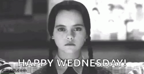 A Black And White Photo Of A Girl With Pigtails Saying Happy Wednesday . GIF