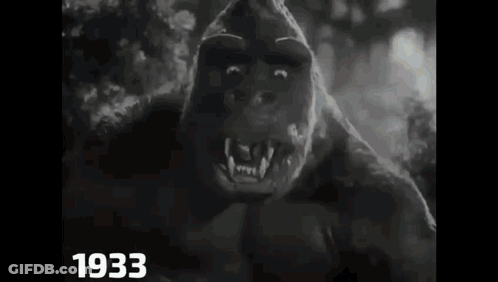 A Black And White Photo Of A Gorilla In A Movie . GIF