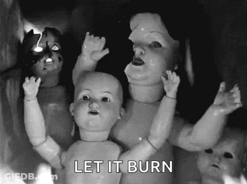 A Black And White Photo Of A Group Of Dolls With The Words Let It Burn Below Them GIF