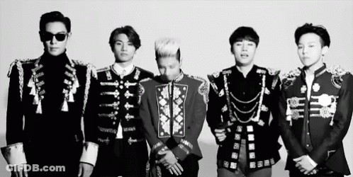 A Black And White Photo Of A Group Of Men In Military Uniforms Standing Next To Each Other GIF