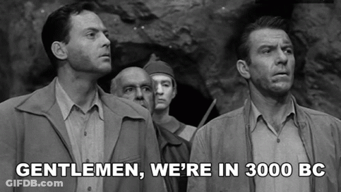 A Black And White Photo Of A Group Of Men With Gentlemen We 'Re In 3000 Bc Written Below Them GIF