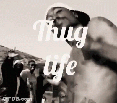 A Black And White Photo Of A Group Of Men With The Words `` Thug Life '' Written Above Them . GIF