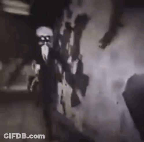 A Black And White Photo Of A Group Of People Holding Guns In A Dark Room . GIF