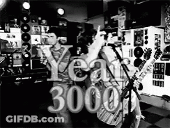 A Black And White Photo Of A Group Of People Playing Guitars And Singing Into Microphones . GIF