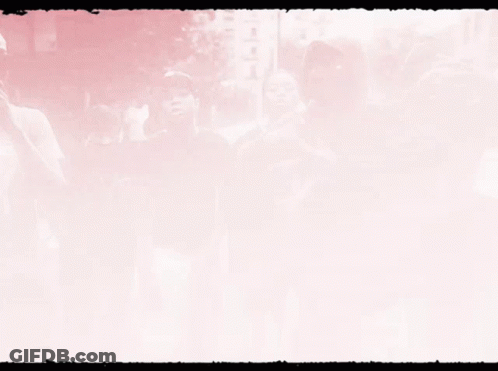 A Black And White Photo Of A Group Of People With The Letters Tcr On Their Faces GIF