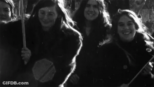 A Black And White Photo Of A Group Of Young Women GIF
