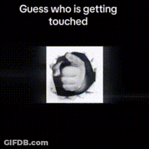 A Black And White Photo Of A Hand Sticking Out Of A Hole In The Wall . GIF