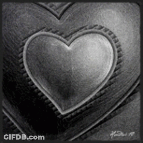 A Black And White Photo Of A Heart In The Middle Of Two Hearts . GIF