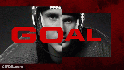 A Black And White Photo Of A Hockey Player With The Word Goal In White GIF