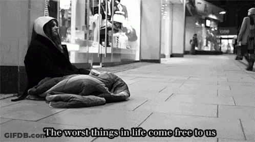 A Black And White Photo Of A Homeless Person With The Words " The Worst Things In Life Come Free To Us " Above Them GIF