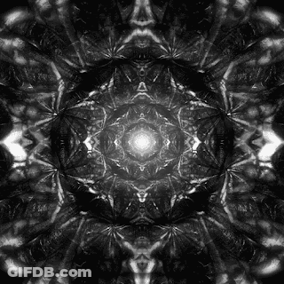 A Black And White Photo Of A Kaleidoscope With A Glowing Center . GIF