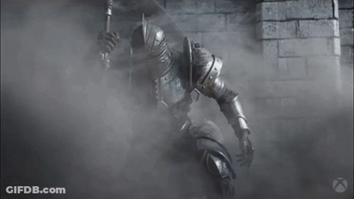 A Black And White Photo Of A Knight In Armor Holding A Sword GIF