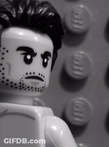 A Black And White Photo Of A Lego Man GIF