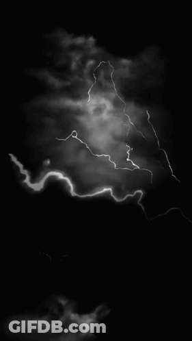 A Black And White Photo Of A Lightning Bolt In The Sky GIF