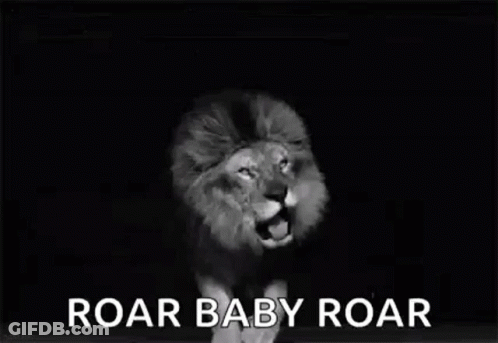 A Black And White Photo Of A Lion Roaring With The Words `` Roar Baby Roar '' Written Below It . GIF