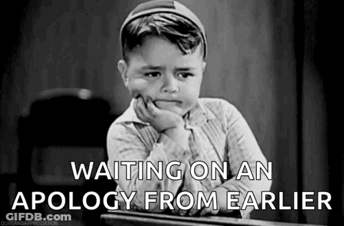 Black And White Photo Of Boy Sitting At Desk GIF