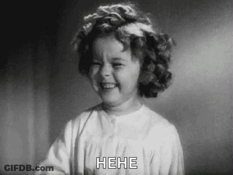 A Black And White Photo Of A Little Girl Laughing GIF
