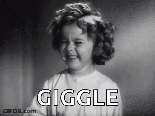 A Black And White Photo Of A Little Girl Laughing With The Word Giggle In The Background . GIF