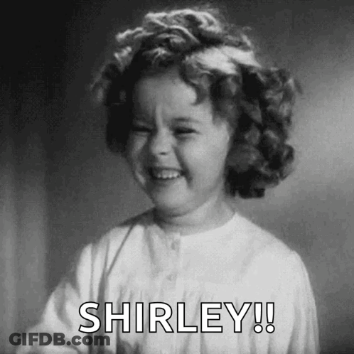 A Black And White Photo Of A Little Girl Laughing With The Words Shirley ! GIF