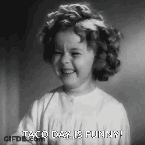 A Black And White Photo Of A Little Girl Laughing With The Words Taco Day Is Funny . GIF