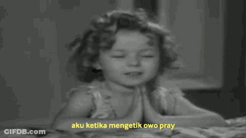 A Black And White Photo Of A Little Girl Praying With The Words Aku Ketika Mengetik Owo Pray Above Her GIF