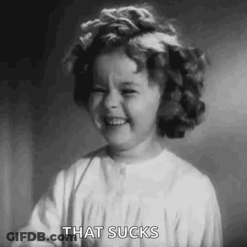A Black And White Photo Of A Little Girl With A Flower In Her Hair . GIF
