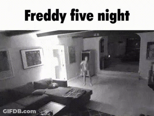 A Black And White Photo Of A Living Room With A Person Standing In It . GIF