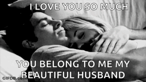 A Black And White Photo Of A Man And A Woman Hugging Each Other . GIF