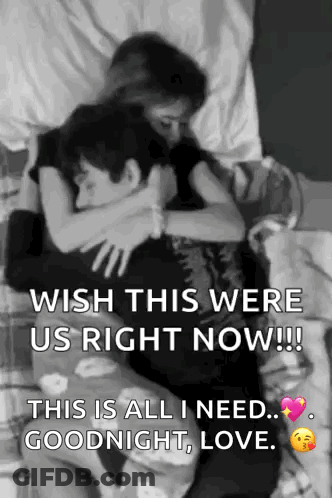 A Black And White Photo Of A Man And A Woman Hugging Each Other . GIF
