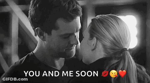 A Black And White Photo Of A Man And A Woman Kissing With The Words You And Me Soon Below Them GIF