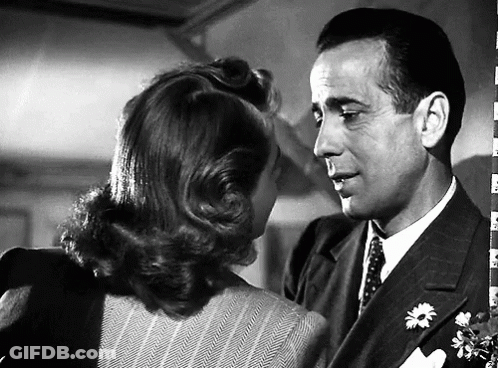 A Black And White Photo Of A Man And A Woman GIF
