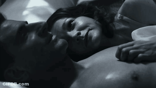 A Black And White Photo Of A Man And A Woman GIF