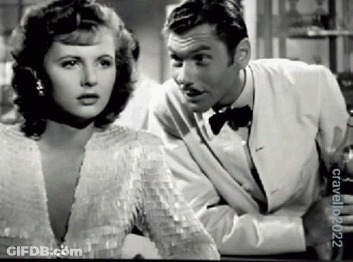 A Black And White Photo Of A Man And A Woman Taken By Crawford 2002 GIF