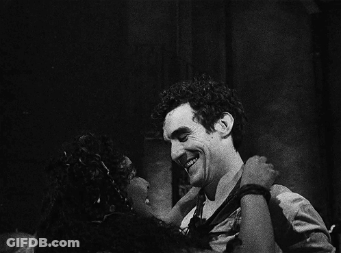 A Black And White Photo Of A Man And A Woman GIF