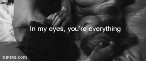 A Black And White Photo Of A Man And A Woman With The Words In My Eyes You 'Re Everything GIF