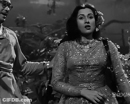A Black And White Photo Of A Man And A Woman With The Words Shemel On The Bottom GIF