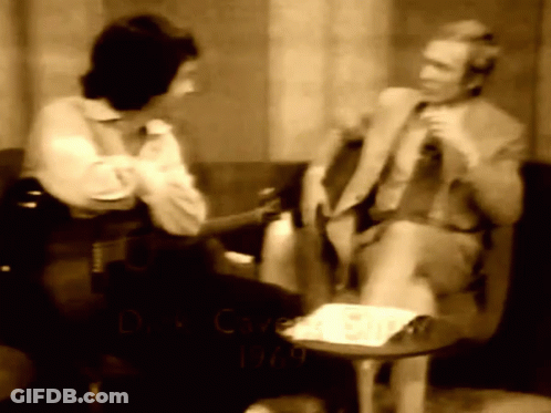 A Black And White Photo Of A Man And A Woman With The Year 1969 GIF