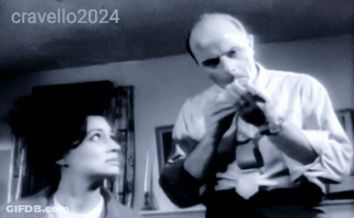 A Black And White Photo Of A Man And A Woman With The Year 2024 GIF