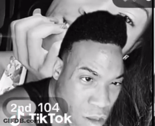 A Black And White Photo Of A Man And A Woman With Tiktok Written On The Bottom GIF