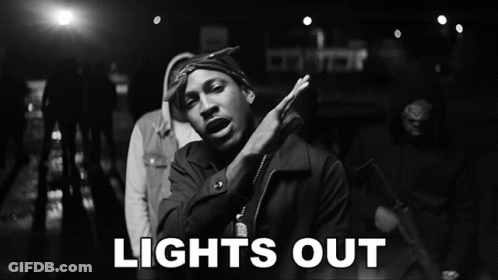 A Black And White Photo Of A Man And The Words Lights Out GIF