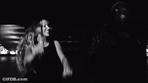 A Black And White Photo Of A Man And Woman Dancing GIF