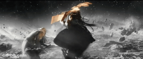 A Black And White Photo Of A Man And Woman Fighting GIF