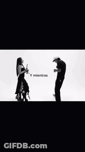 A Black And White Photo Of A Man And Woman GIF
