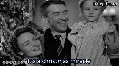 A Black And White Photo Of A Man And Woman Holding A Child . GIF