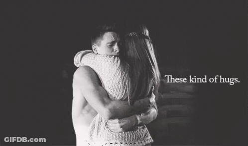 A Black And White Photo Of A Man And Woman Hugging With The Words These Kind Of Hugs Below Them GIF